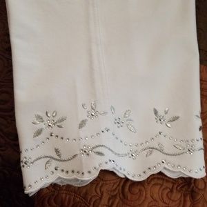 White capris with rhinestone embelishments